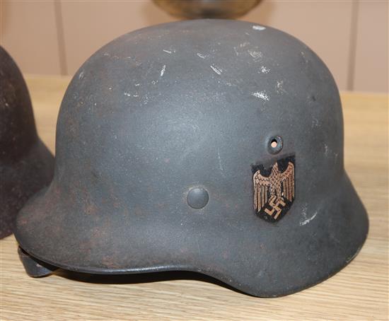 Seven various WWI and WWII helmets